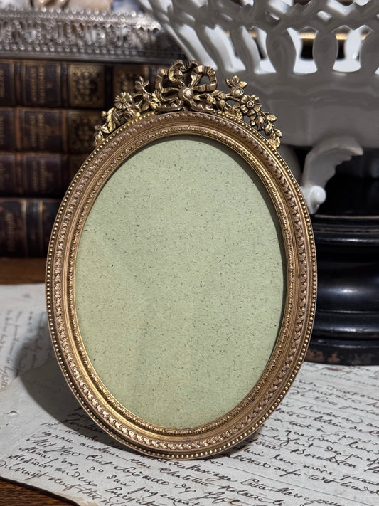 Antique French Bronze Oval Frame with Ribbon Crest